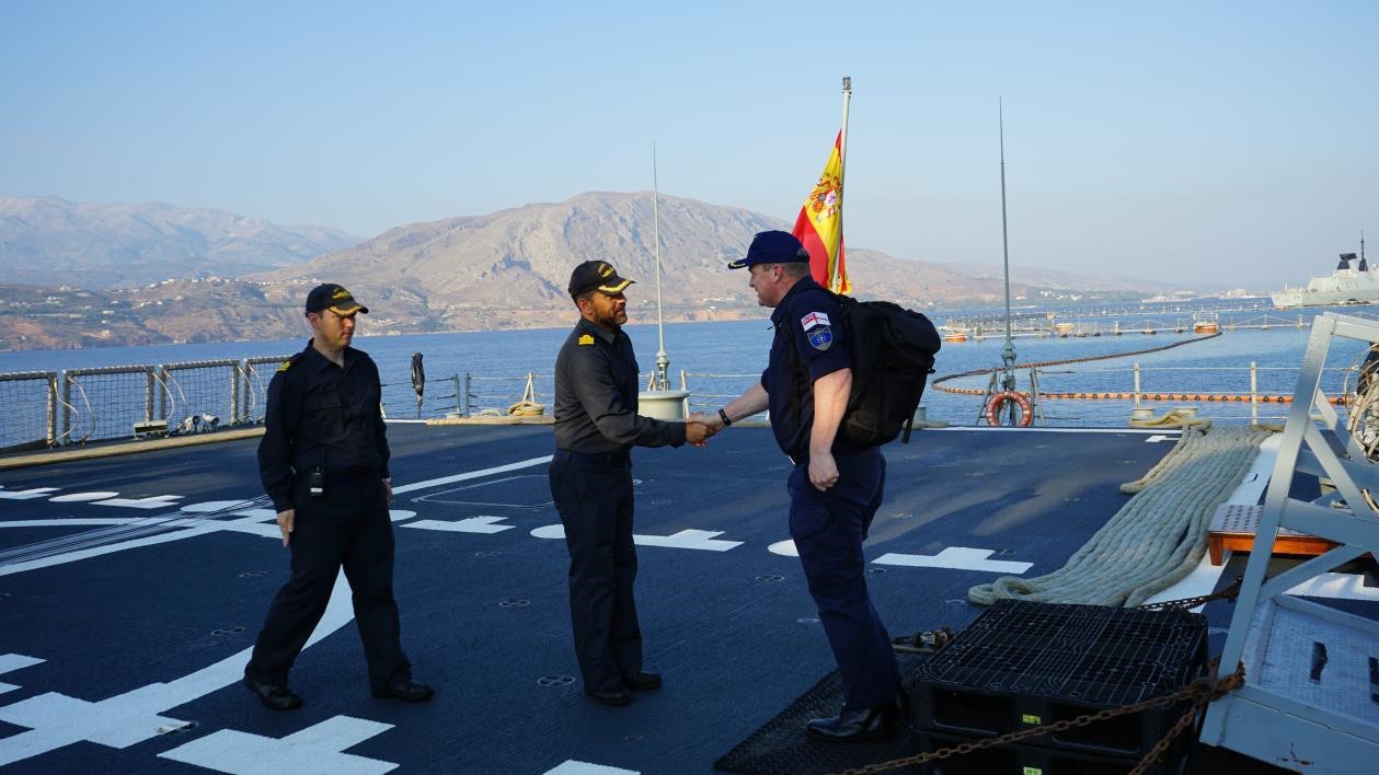 Commander of the frigate salutes Commodore Stroude