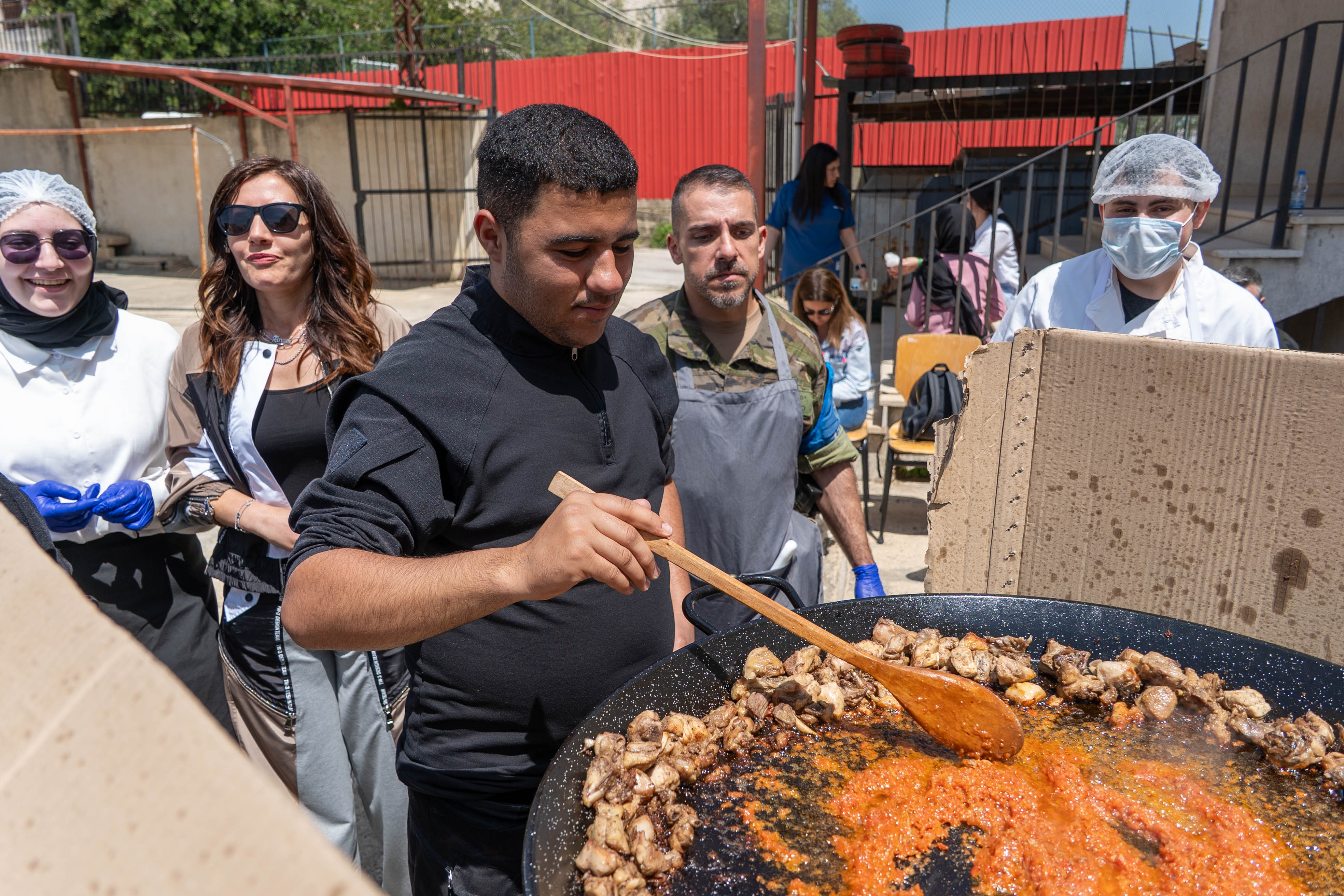 Trainee at the school cooking paella