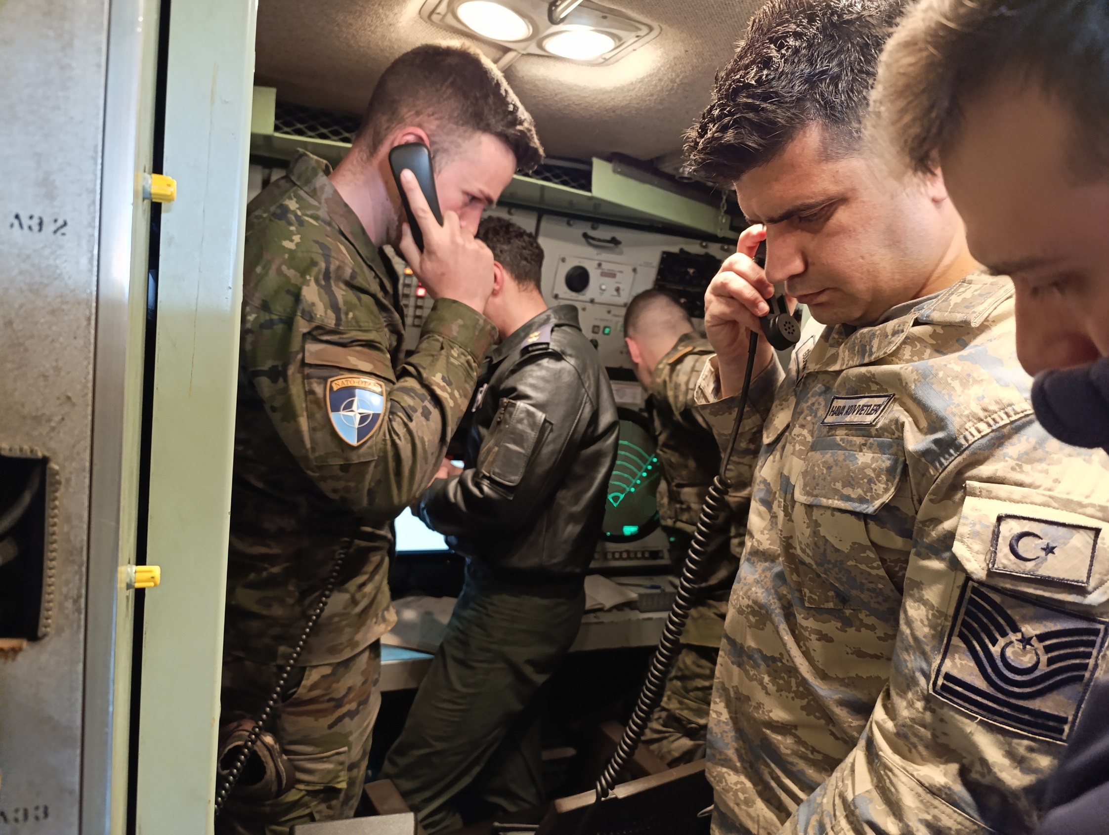 Aircraft are monitored and directed from the ground by Turkish Air Force personnel