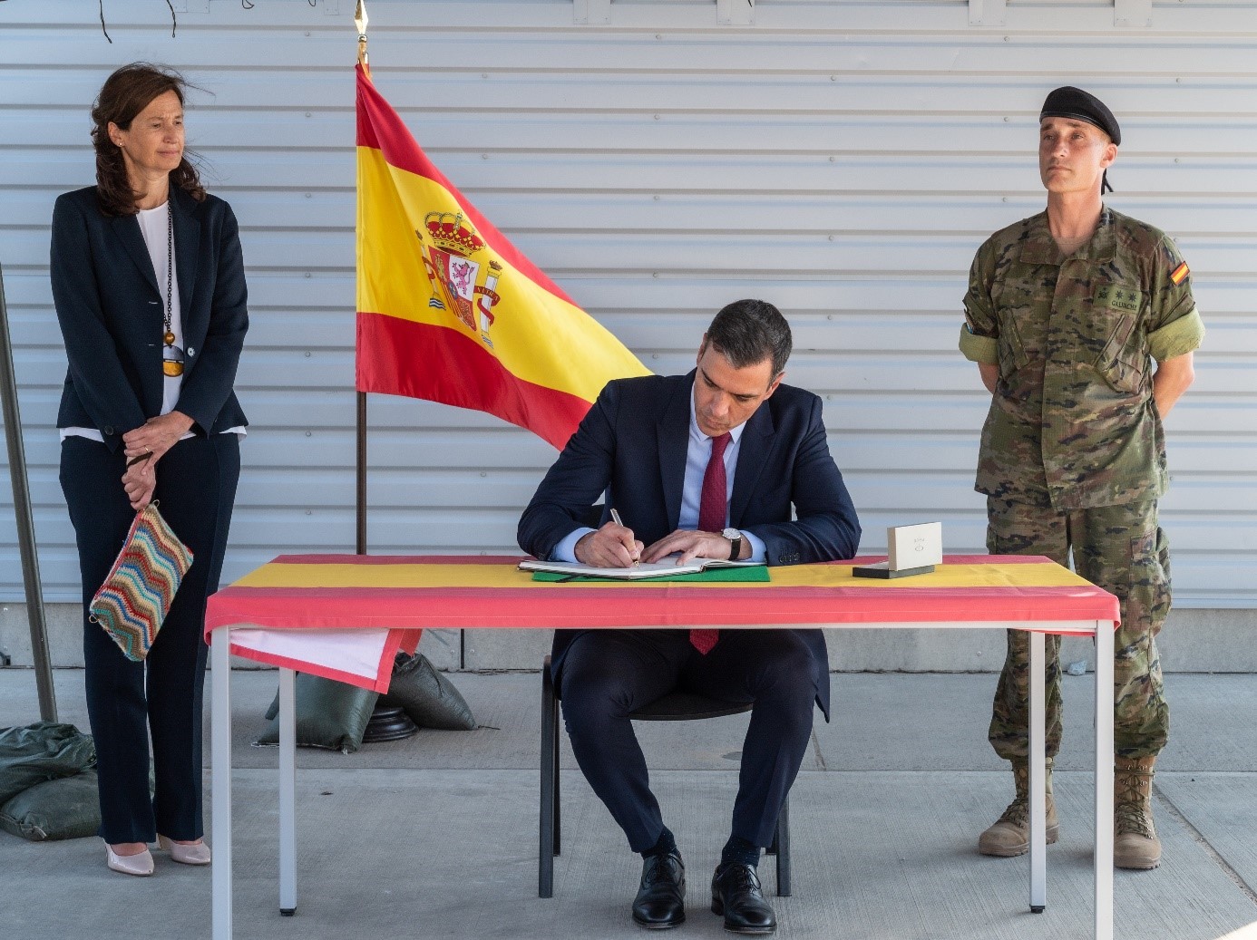 Spain's PM signing the book of honour