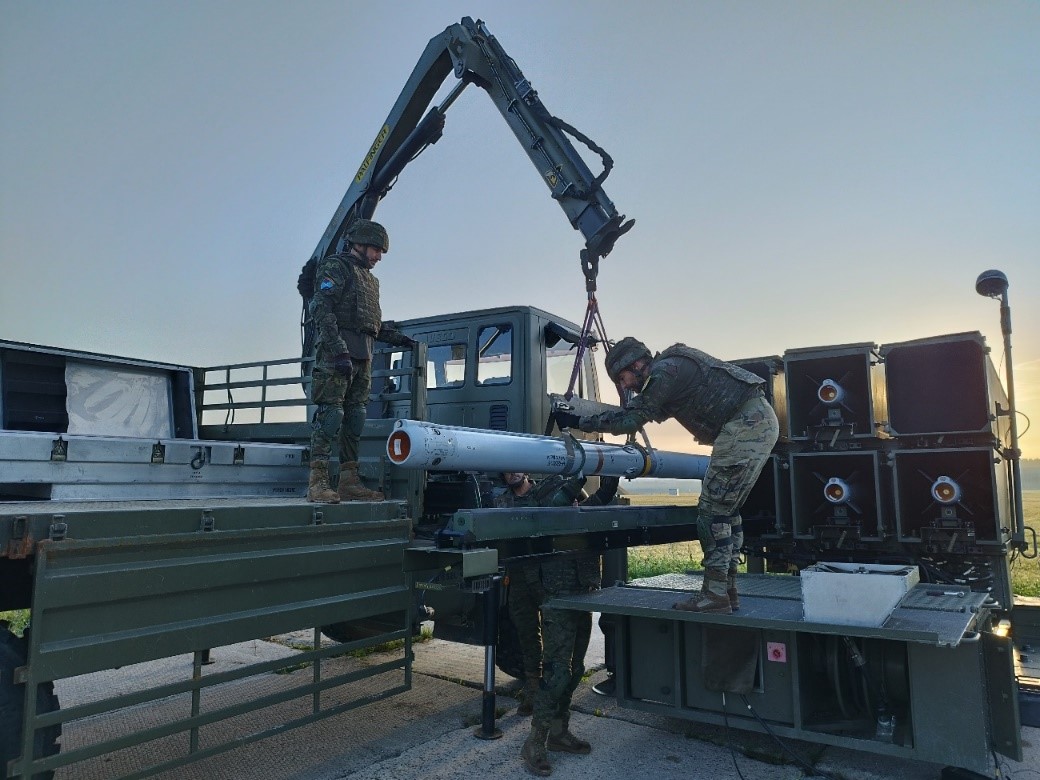  Launcher crew performing handling ammunition 