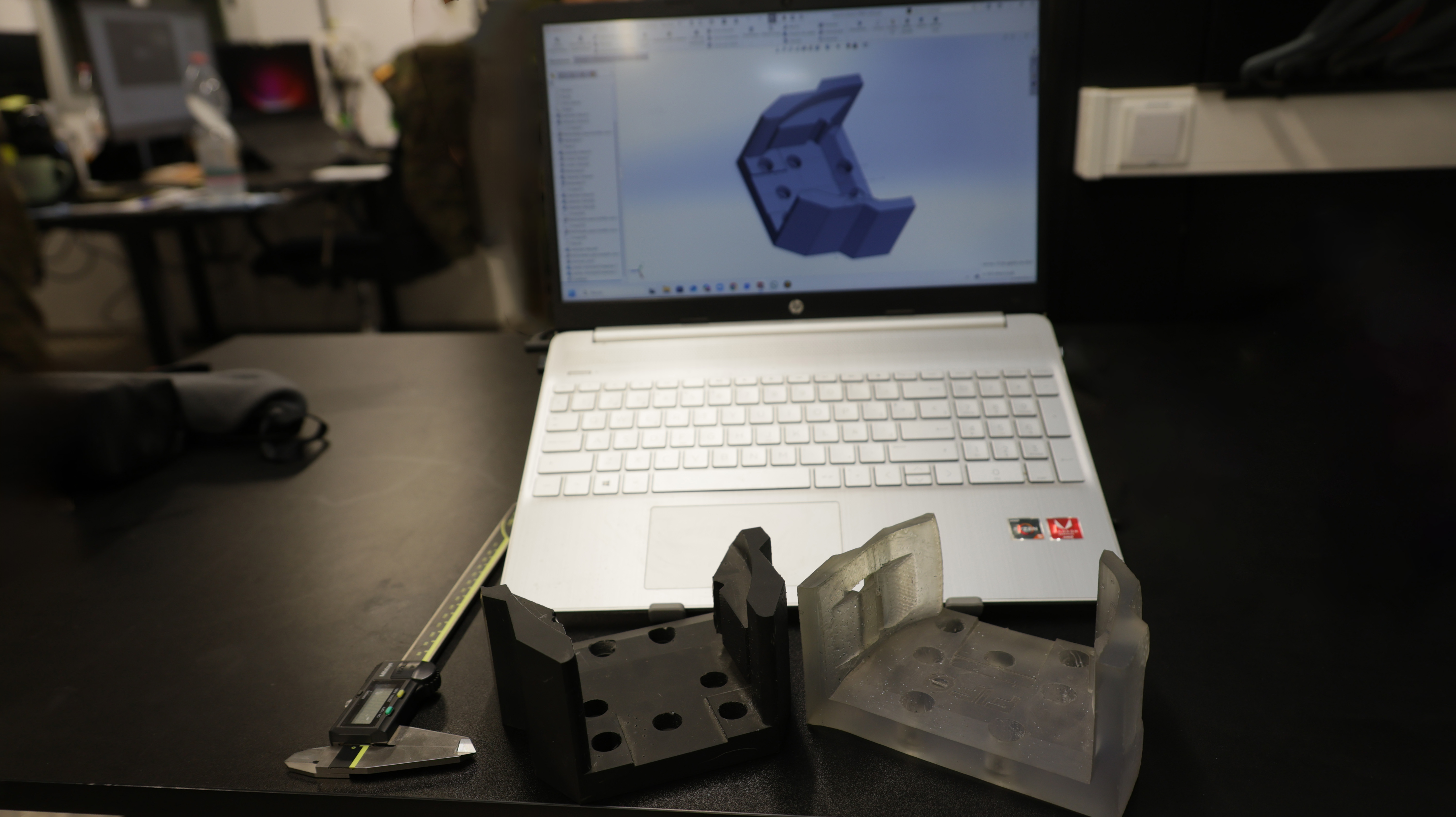 Digital design of a part to support the speakers of a vehicle and the final production manufactured by the Prometheus system.