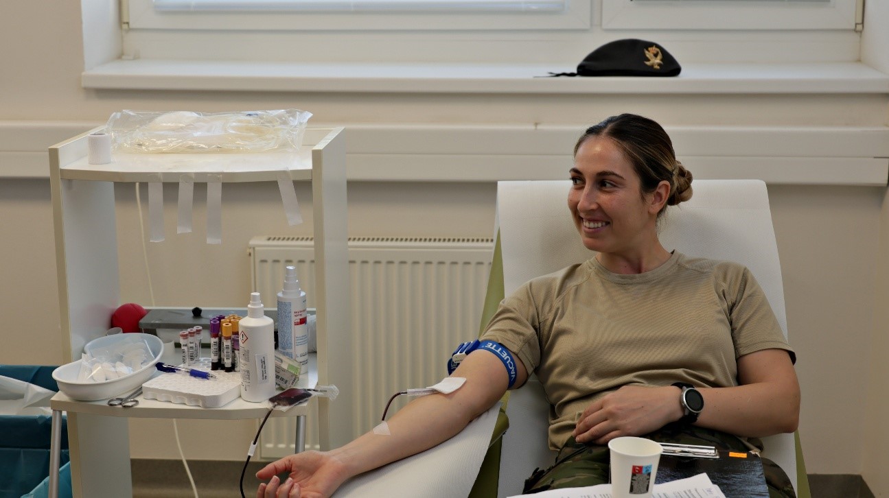 Military personnel donating blood