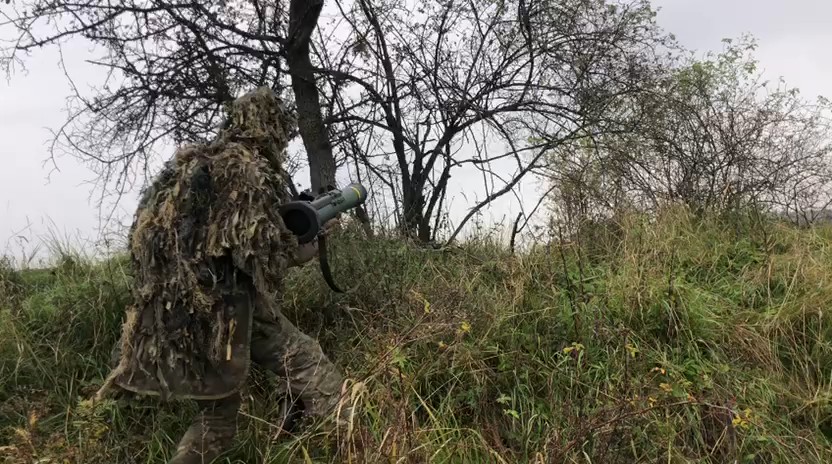 Spanish soldier firing a C-90 grenade launcher