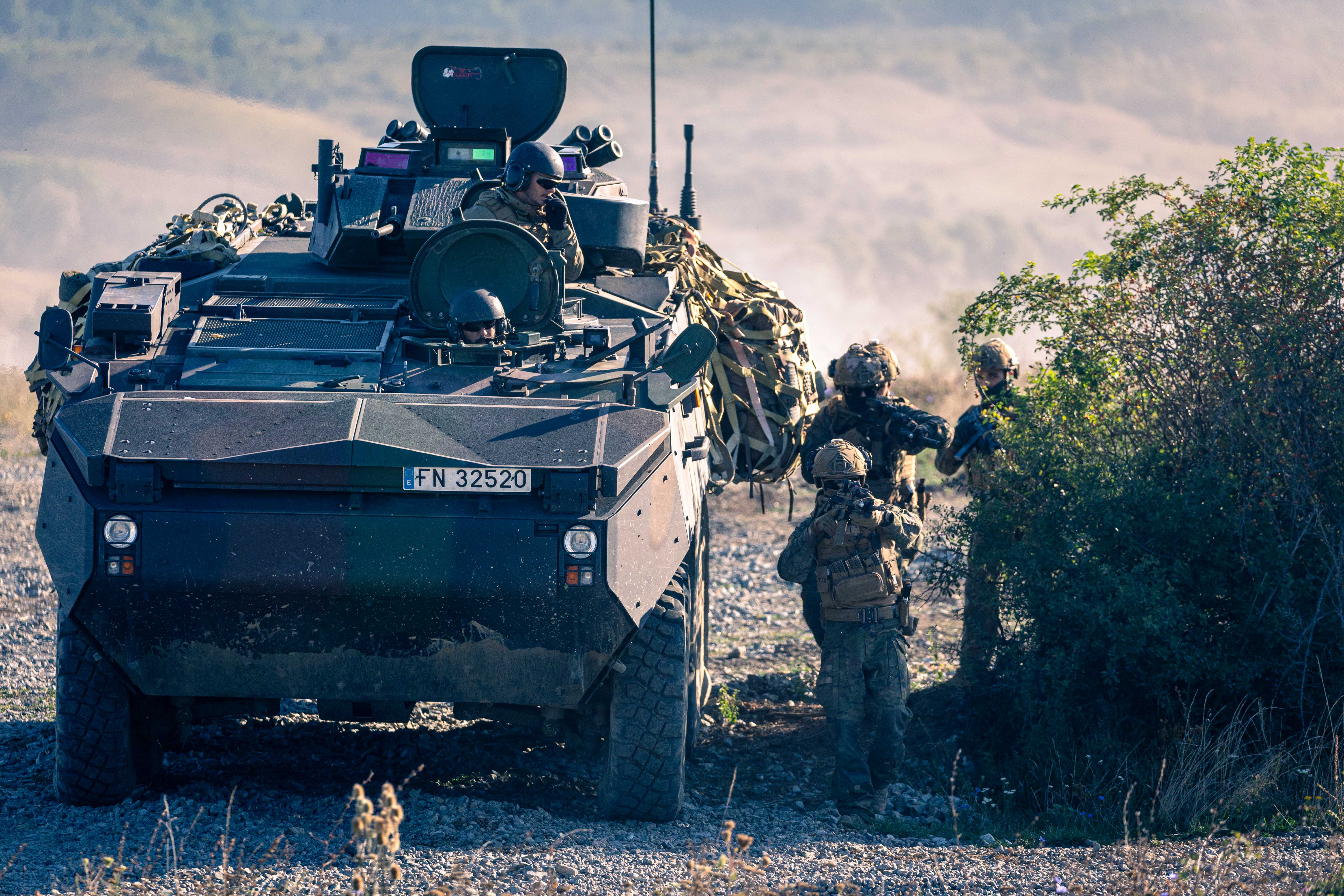 Mechanised platoon disembarking and carrying out an offensive