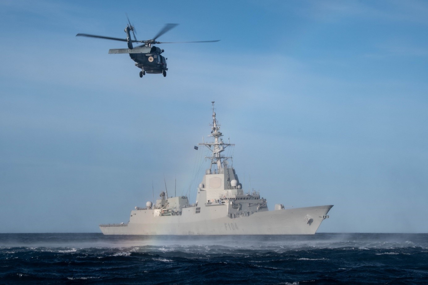 An helicopter flying next to the Spanish frigate