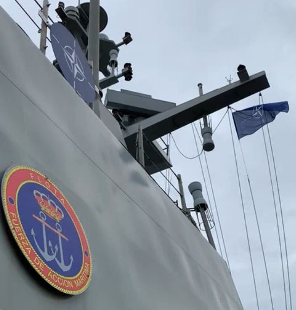 NATO flag flying over the vessel
