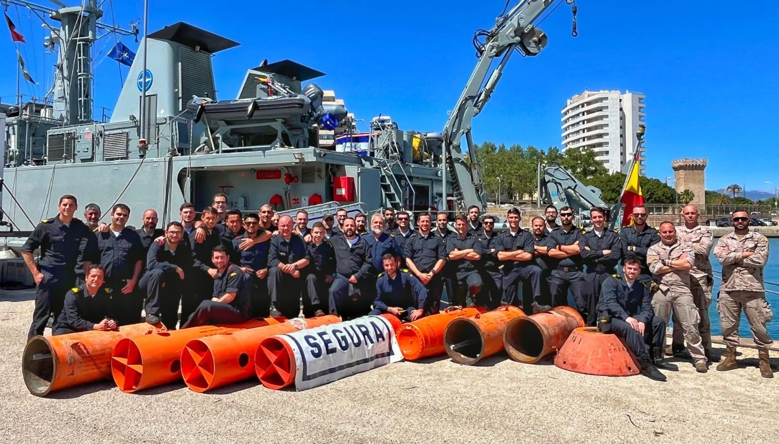 Segura' minehunter crew with part of the recovered mines