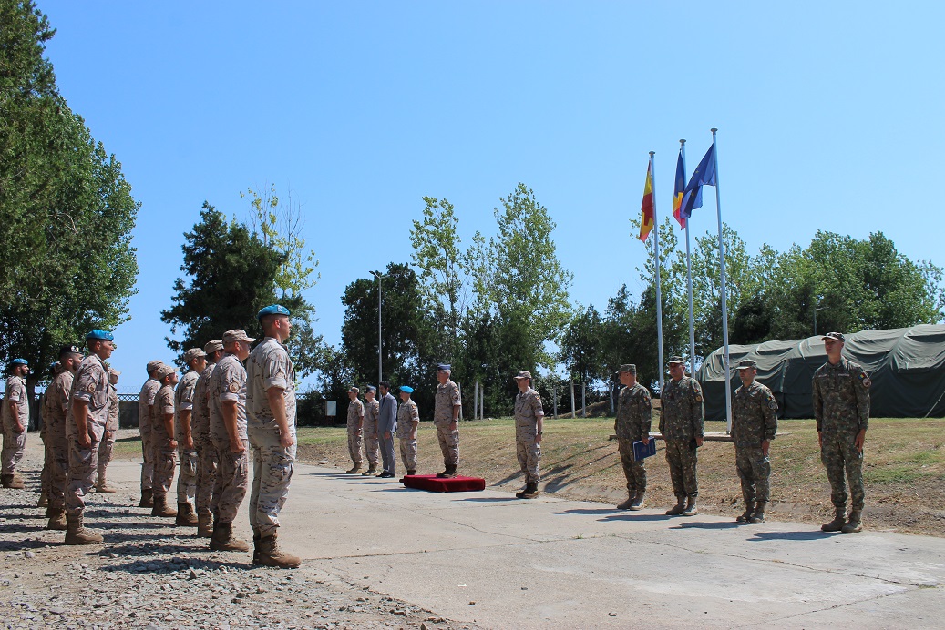 Personnel standing in formation.
