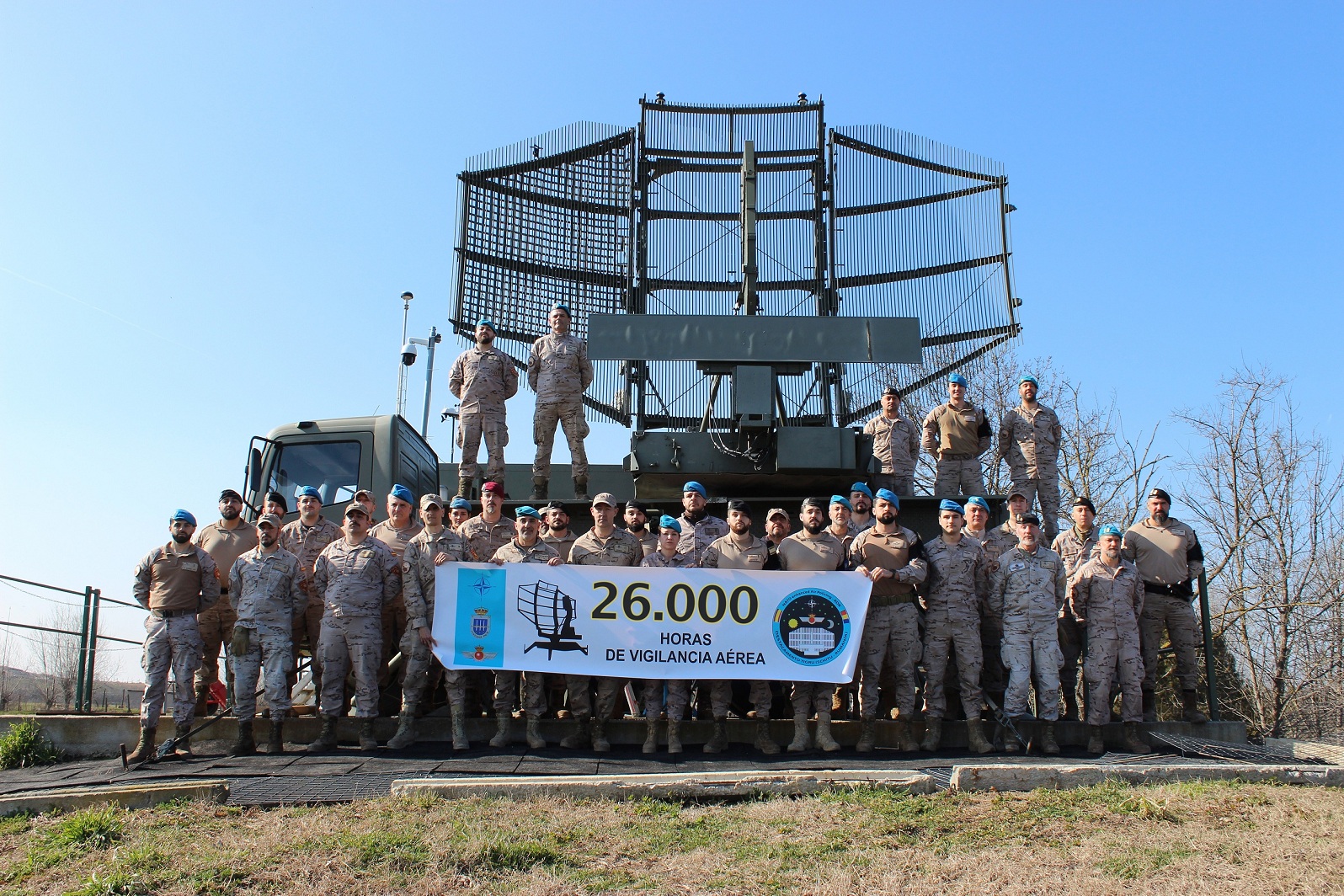 Commemorative photo marking 26,000 hours of aerial surveillance