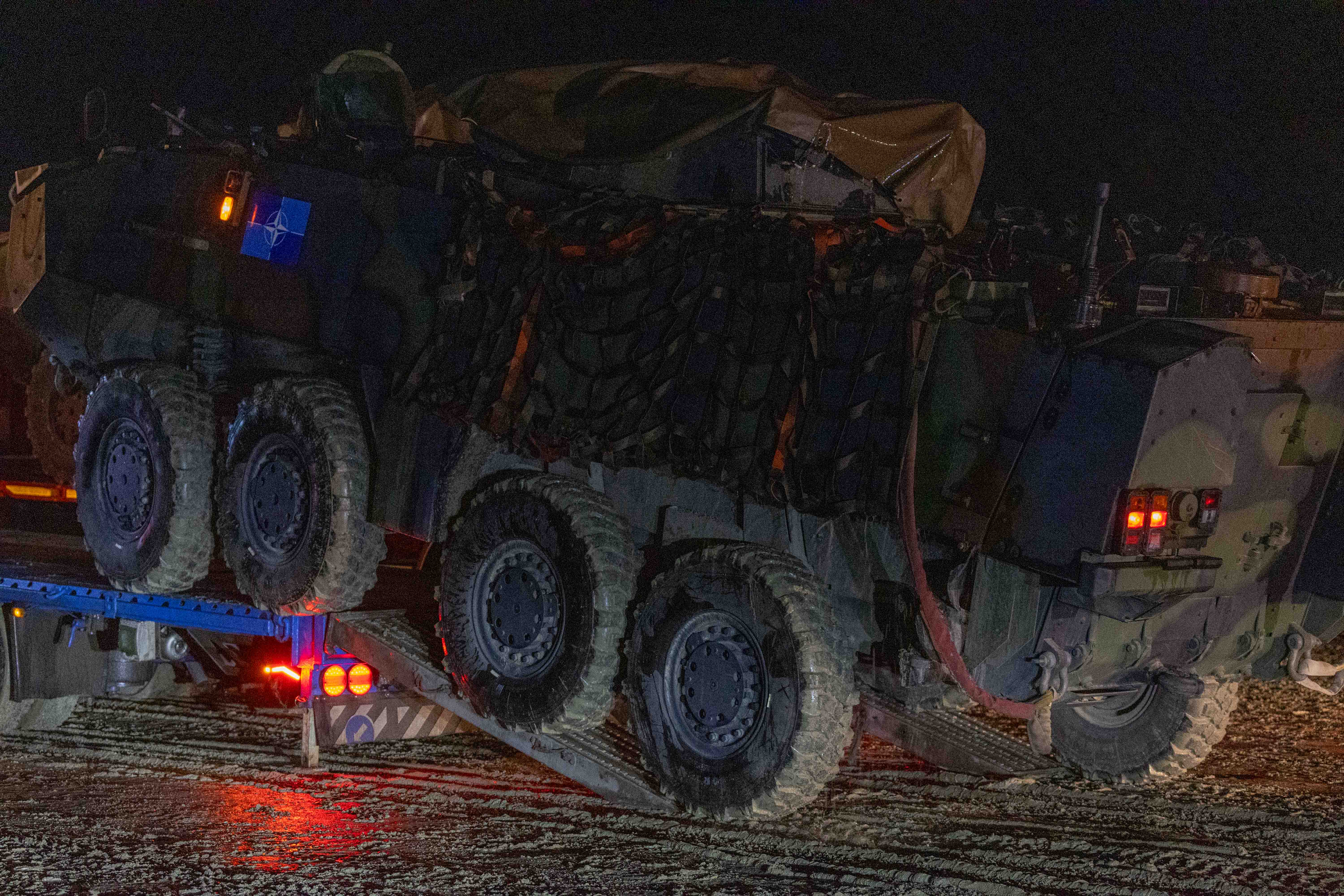 MOWAG PIRANHA IIIC vehicle being loaded onto a barge