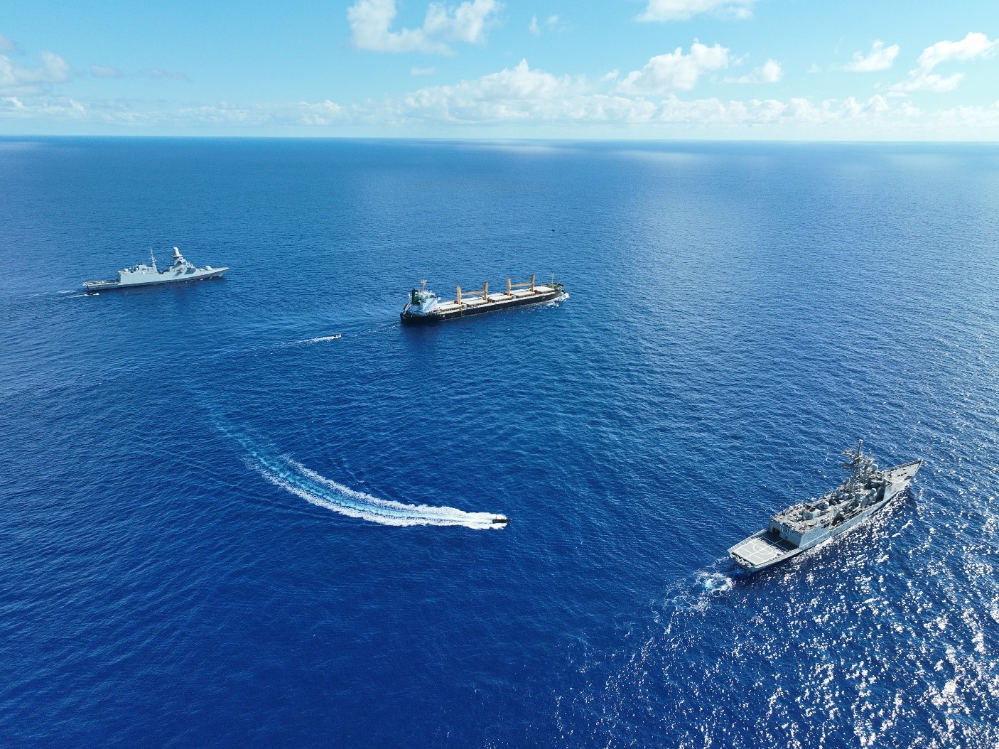 The merchant ship 'Abdullah' is assisted by the frigates 'Canarias' and 'Martinengo'
