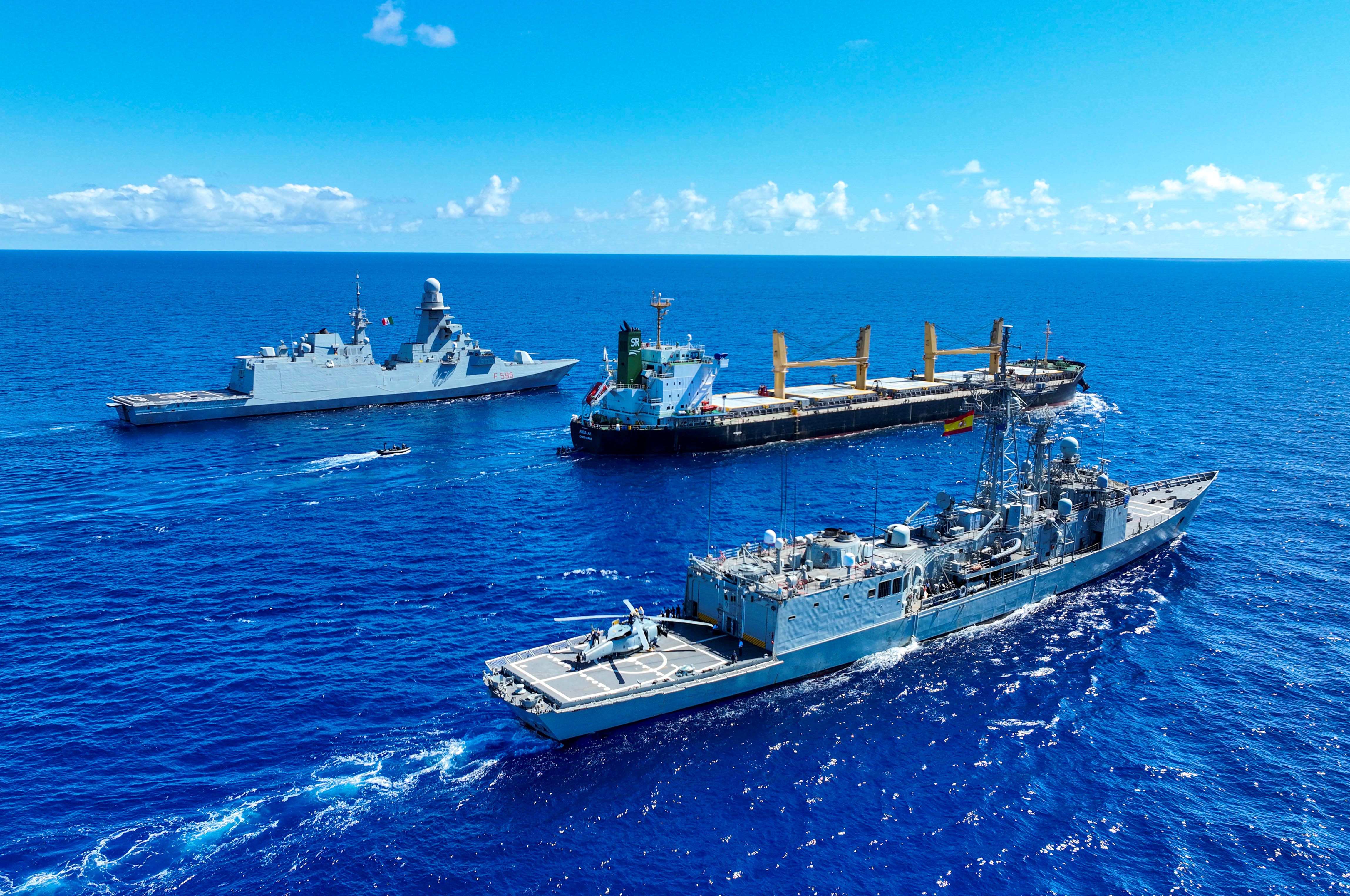 Spanish and Italian frigates escort the MV 'Abdullah' after its release
