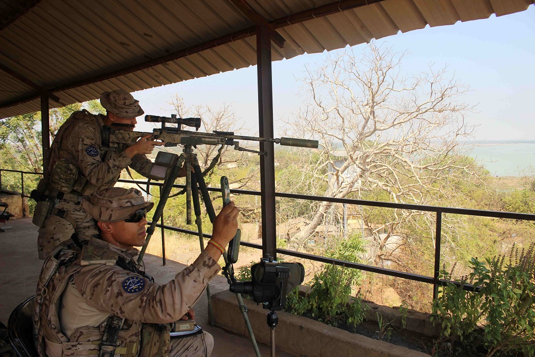 Snipers checking aim and shooting