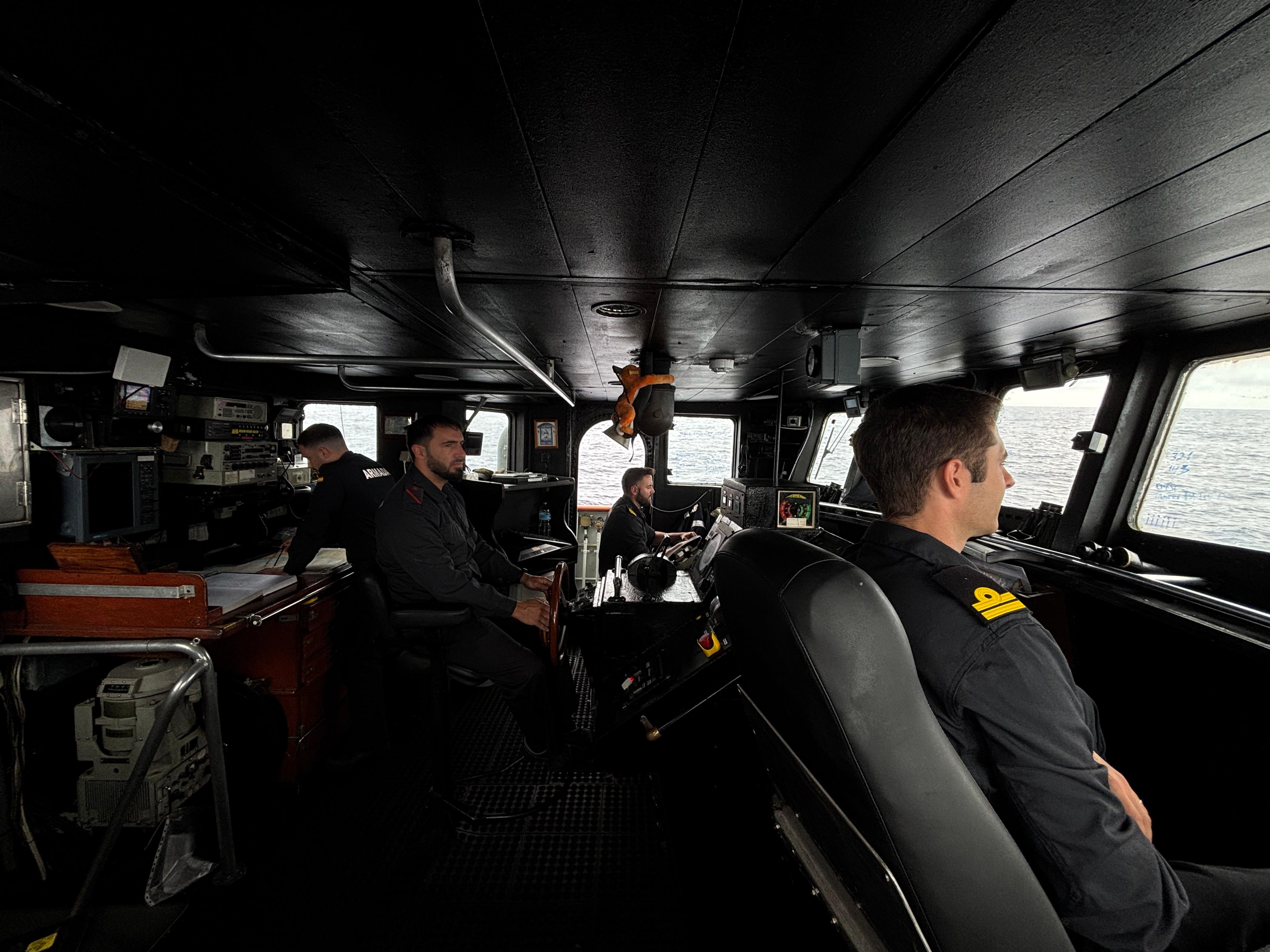 Crew of the Tagomago on the bridge