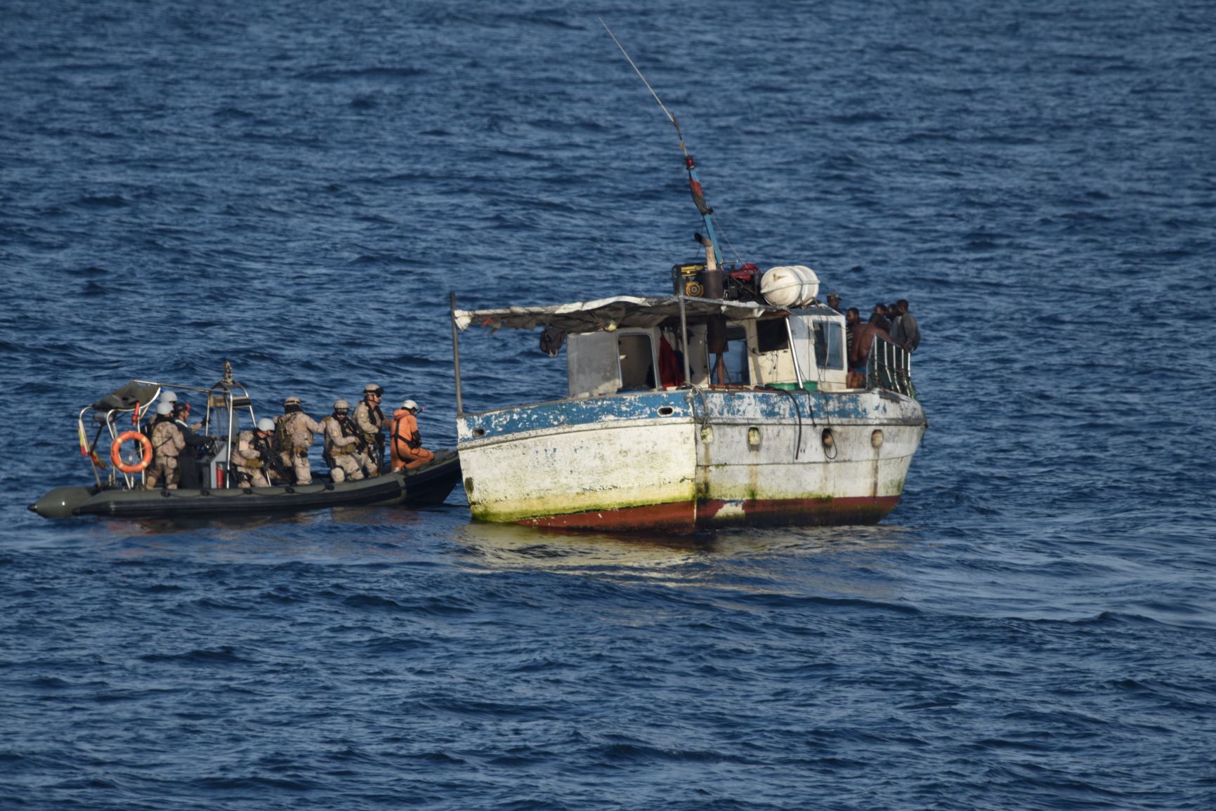The patrol boat “Atalaya” assists a drifting fishing boat in Angolan coast