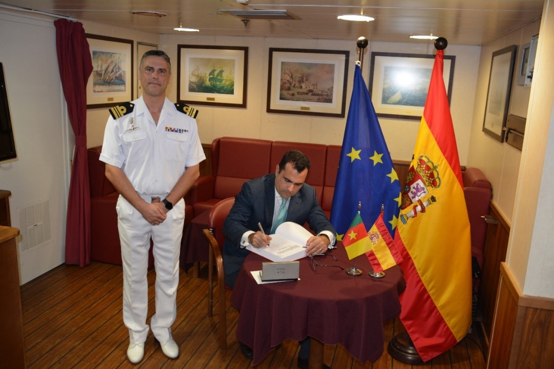 The Spanish Ambassador signs the book of honour
