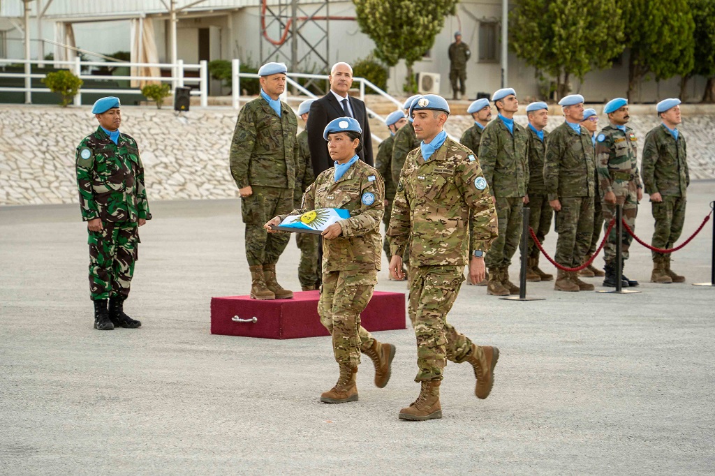 Argentine military carry their flag