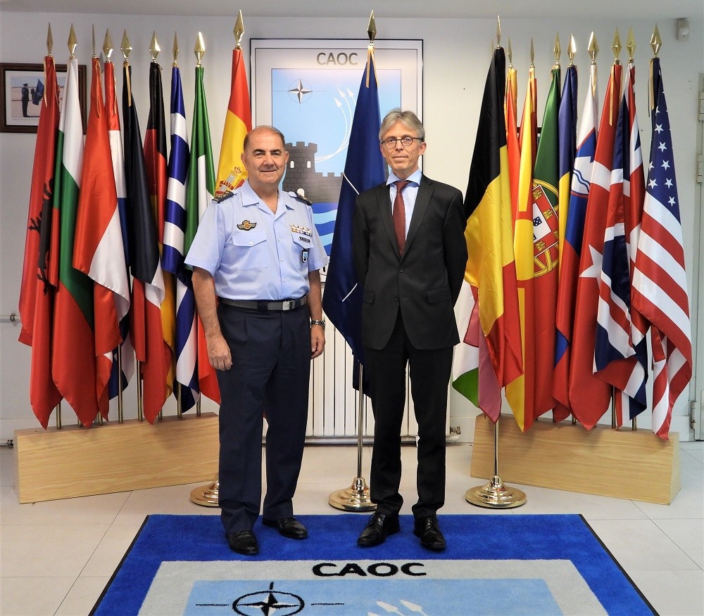COMCAOC and the Belgian ambassador in front of the Alliance’s countries flags