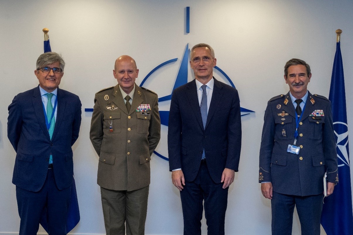 Civilian and military officials with Stoltenberg