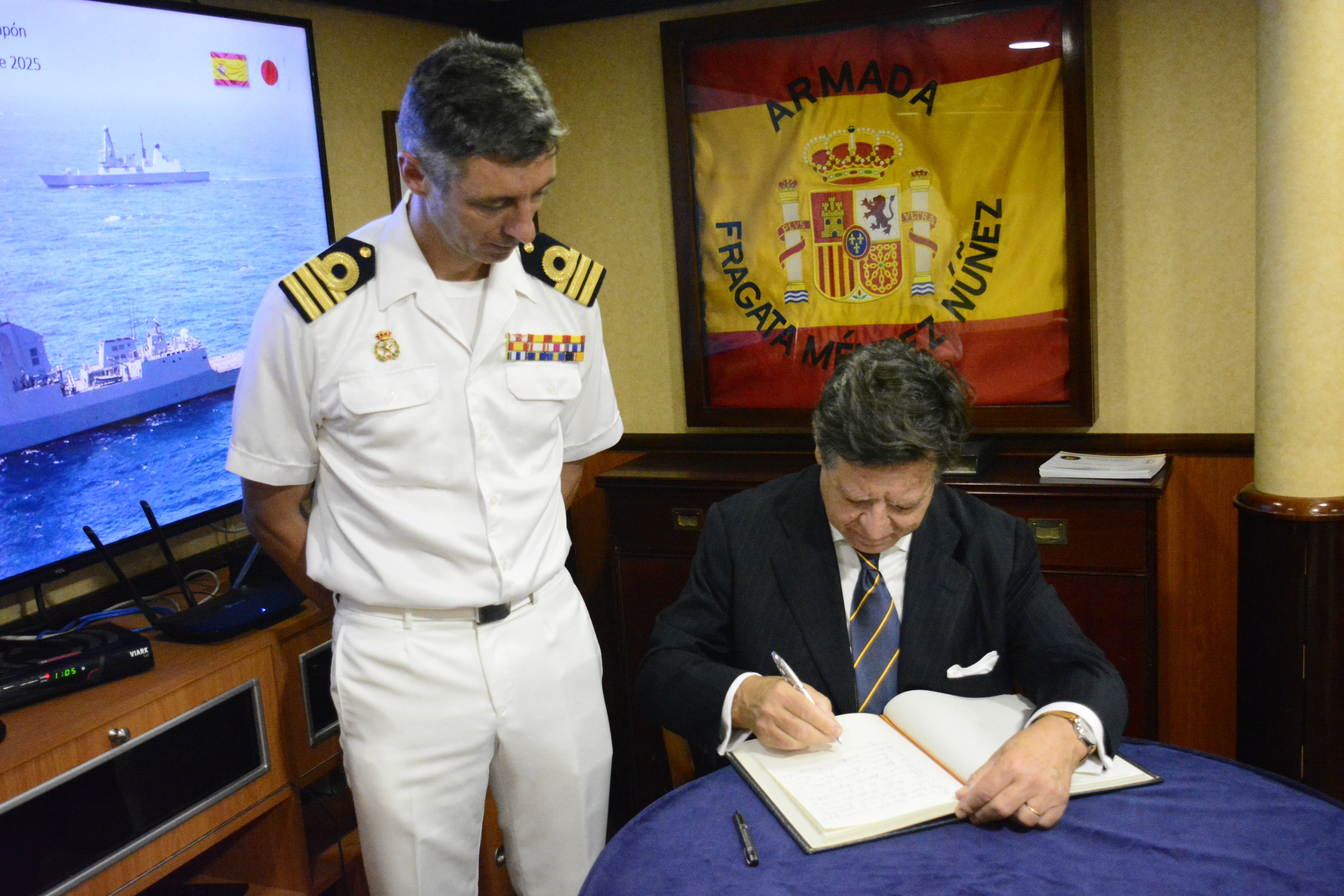 Ambassador signs the book of honour