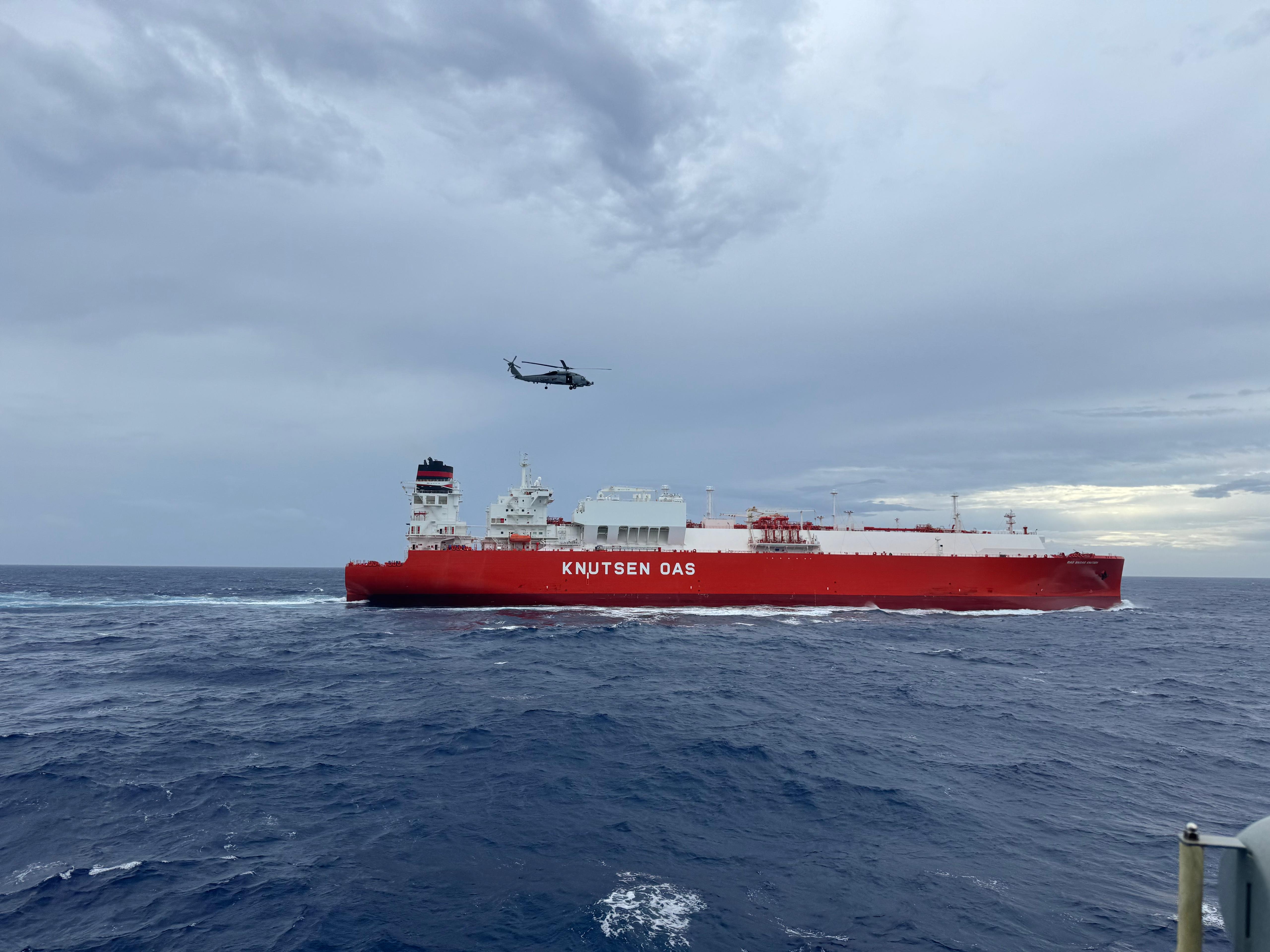A GCE DÉDALO helicopter flying over the civilian vessel