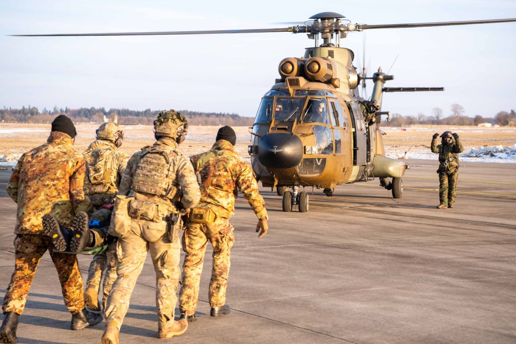 Personnel conducting casualty evacuation